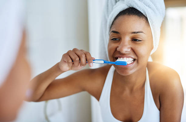 Woman brushing her teeth